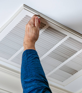 Professional air duct cleaning technician